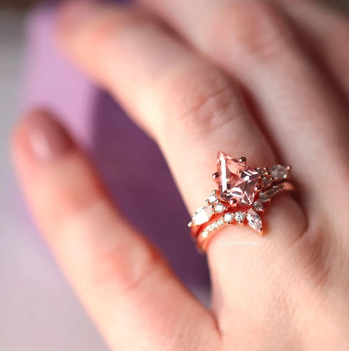 Close-up of hand wearing Skye Kite® Morganite Couples Ring Set with pink gemstone and delicate silver detailing, showcasing Aquamarise's matching couples rings from the Skye Kite® Jewelry Collection.