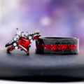 Crushed Red Garnet men's black tungsten wedding band shown as the men's half of the Skye Kite® natural garnet couples ring set by Aquamarise