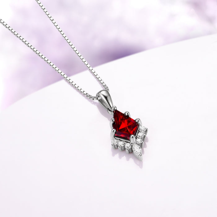 Skye Kite® Natural Red Garnet Necklace in Black Ruthenium by Aquamarise featuring a kite-cut red garnet pendant accented with sparkling simulated diamonds, suspended on a sleek black ruthenium chain, from January Birthstone Jewelry and Skye Kite® Jewelry Collection.