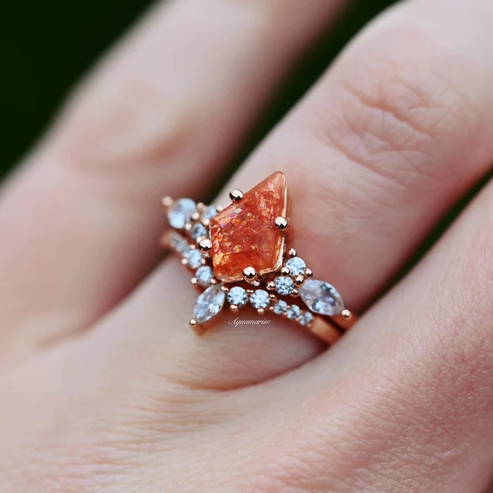 Skye Kite® Natural Sunstone Ring Set in 14K Rose Gold Vermeil by Aquamarise, featuring a kite-cut sunstone with surrounding marquise and round white stones on a hand.
