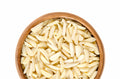Wooden bowl filled with slivered almonds on a white background photo from Nutworks