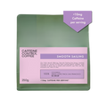 Caffeine Control Coffee package with green and purple design on a white background