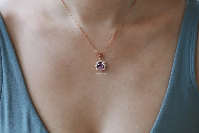 Snowflake Alexandrite Necklace in Sterling Silver by Aquamarise, featuring a color-shifting alexandrite surrounded by white stones on a delicate sterling silver chain.