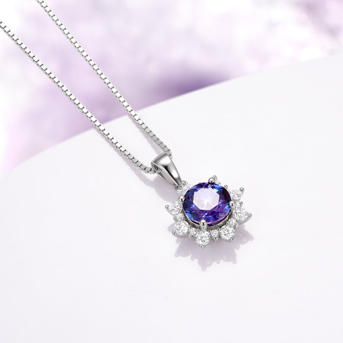 Snowflake Alexandrite Necklace in Sterling Silver by Aquamarise featuring a round teal to violet alexandrite stone surrounded by sparkling white gemstones, elegant and nature-inspired design.