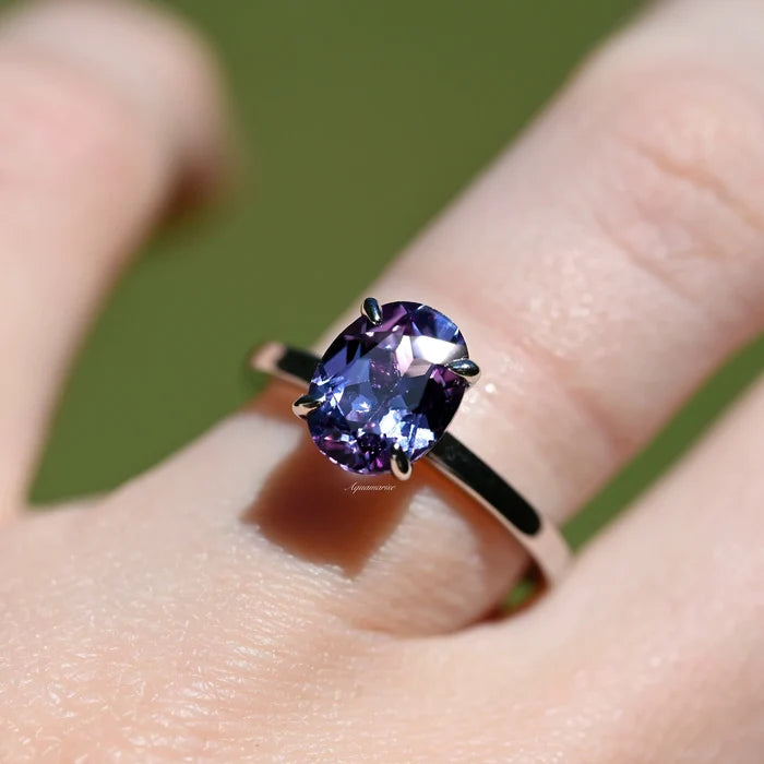 Solitaire 2ct Oval Cut Alexandrite Engagement Ring- Sterling Silver by Aquamarise, featuring a vibrant color-changing oval alexandrite set on a sleek sterling silver band.