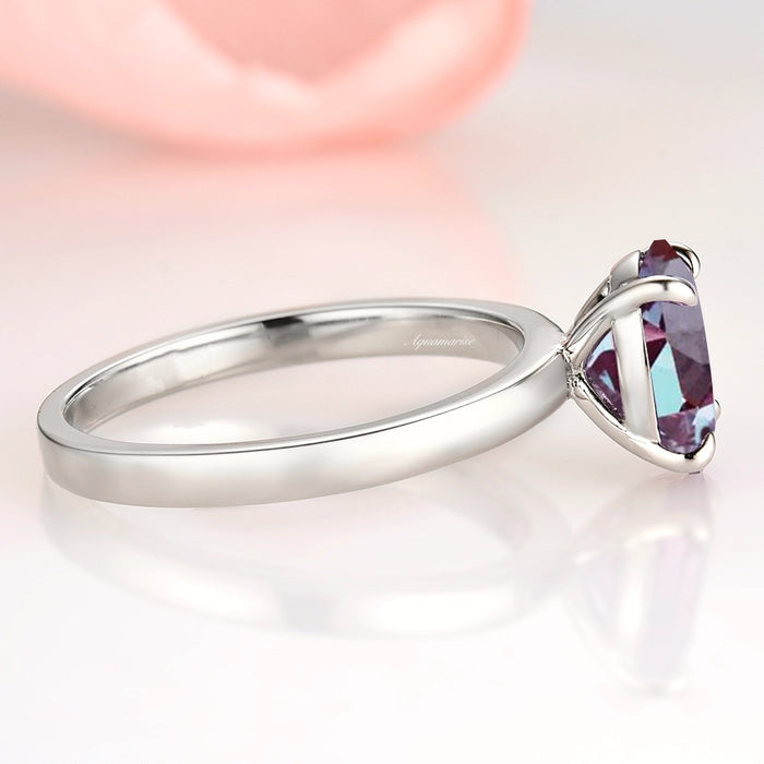 Solitaire 2ct Oval Cut Alexandrite Engagement Ring- Sterling Silver by Aquamarise, featuring a minimalist oval teal and purple alexandrite set in a polished sterling silver band.