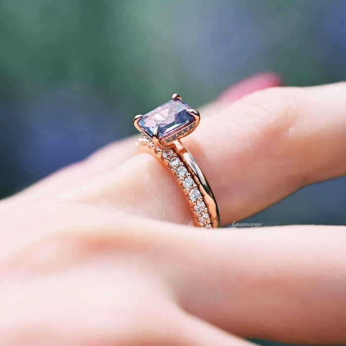 Alexandrite Engagement Ring Set- 14K Rose Gold Vermeil by Aquamarise featuring a minimalist emerald-cut color-changing alexandrite with delicate diamond accents on a polished rose gold band.