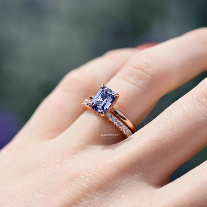 Alexandrite Engagement Ring Set- 14K Rose Gold Vermeil by Aquamarise featuring a color-changing emerald-cut alexandrite with delicate diamond accents on a polished rose gold band.
