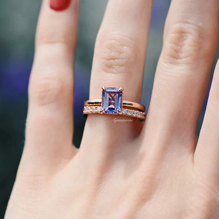 Alexandrite Engagement Ring Set- 14K Rose Gold Vermeil by Aquamarise, showcasing a minimalist emerald-cut color-changing alexandrite with delicate diamond-accented rose gold bands on a hand.