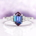 Sonnet Hexagon Cut Alexandrite Engagement Ring in 14K White Gold by Aquamarise Gold, featuring a striking hexagon-cut alexandrite with sparkling diamond accents in a modern elegant design.