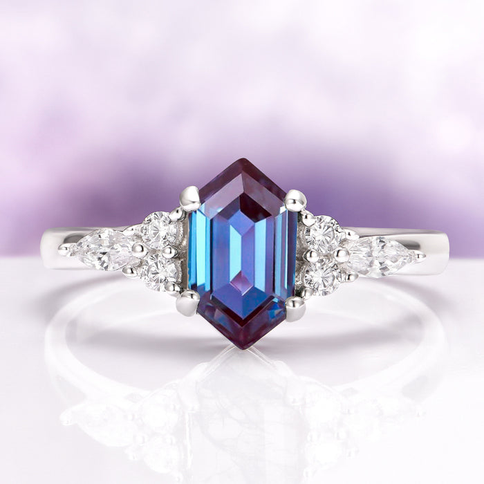 Sonnet Hexagon Cut Alexandrite Engagement Ring in 14K White Gold by Aquamarise Gold, featuring a striking hexagon-cut alexandrite with sparkling diamond accents in a modern elegant design.