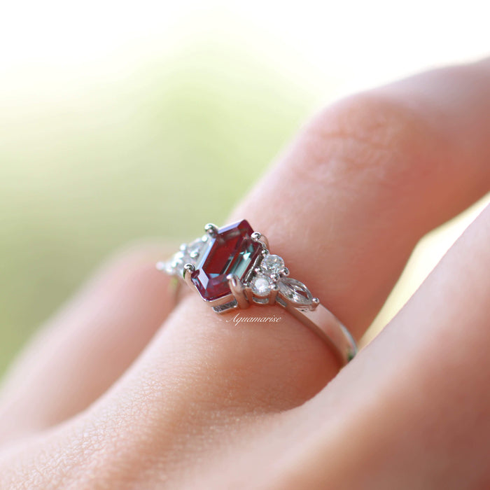 Sonnet Hexagon Cut Alexandrite Engagement Ring in 14K White Gold by Aquamarise Gold, featuring a deep red hexagon-cut alexandrite accented with sparkling diamonds on a sleek white gold band.