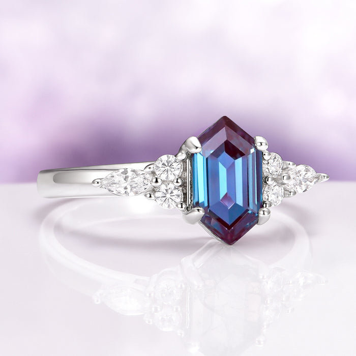 Sonnet Hexagon Cut Alexandrite Engagement Ring in 14K White Gold by Aquamarise Gold featuring a vibrant hexagon-cut alexandrite with pear and round diamond accents in a modern design.