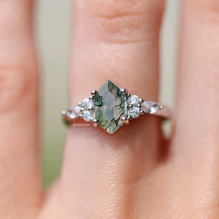 Sonnet Hexagon Green Moss Agate Ring in Sterling Silver by Aquamarise featuring a hexagon-cut moss agate with delicate inclusions and sparkling white gemstone accents on a silver band.
