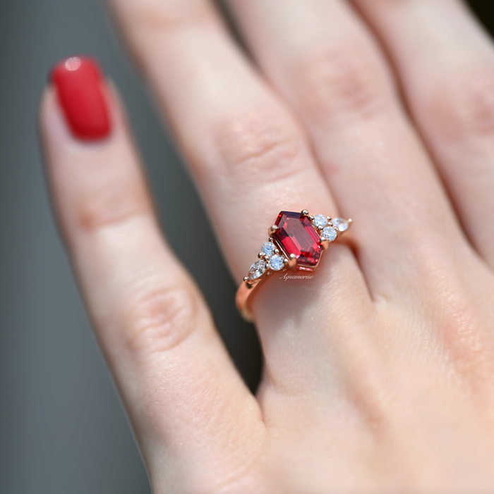 Sonnet Hexagon Ruby Ring- 14K Rose Gold Vermeil by Aquamarise, featuring a hexagonal ruby center flanked by oval and round clear stones on a rose gold vermeil band.
