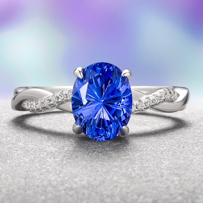 Sophia Fantasy Cut Sapphire Engagement Ring in 14K White Gold by Aquamarise Gold showcases a vibrant blue fireworks-cut sapphire set on an elegant twisted white gold band accented with sparkling diamonds, part of Solid Gold Engagement Rings and September Birthstone Jewelry collections.