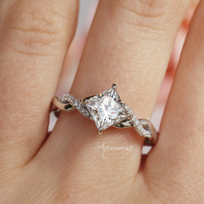 Sophia Princess Cut White Sapphire Ring in Sterling Silver by Aquamarise featuring a 7mm princess-cut white sapphire with a twisted vine band set with sparkling pavé stones.