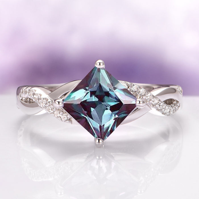 Sophia Twisted Vine Alexandrite Engagement Ring in 14K White Gold by Aquamarise Gold showcases a princess-cut alexandrite center stone with a twisted white gold band accented by sparkling diamonds, part of Solid Gold Engagement Rings, June Birthstone Jewelry, and Nature-Inspired collections.