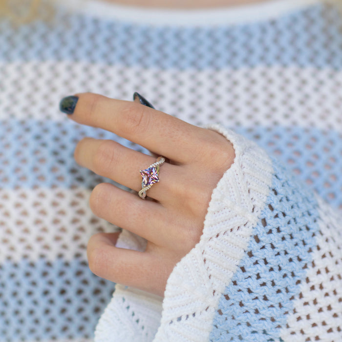 Sophia Twisted Vine Alexandrite Engagement Ring in 14K White Gold by Aquamarise Gold features a princess-cut alexandrite stone set on a twisted white gold band with delicate vine-inspired details, part of multiple collections including Solid Gold Engagement Rings and June Birthstone Jewelry.