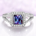 Split Shank Halo Alexandrite Engagement Ring in Sterling Silver by Aquamarise, featuring a princess-cut alexandrite center with a halo and split shank band adorned with sparkling stones.