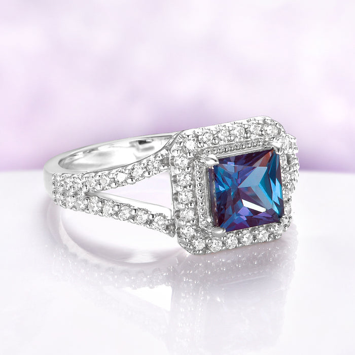 Split Shank Halo Alexandrite Engagement Ring in Sterling Silver by Aquamarise, showcasing a princess-cut alexandrite surrounded by pavé diamonds on a split shank sterling silver band.