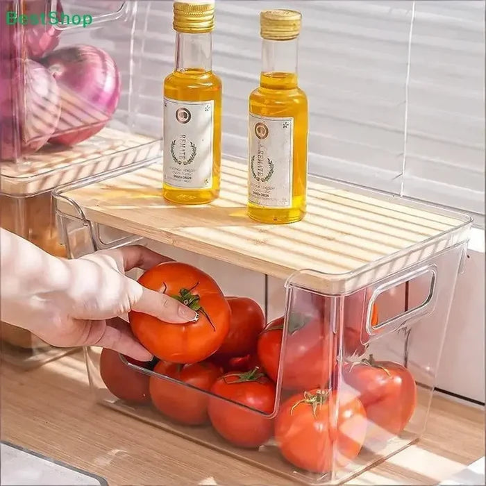 Stackable pantry organizer bins with natural bamboo lid holding tomatoes and bottles of oil for a tidy kitchen.