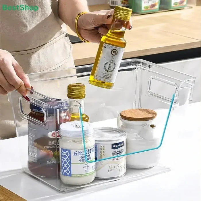 Stackable pantry organizer bins holding condiments and oils in clear PET with bamboo lid for clutter-free storage.