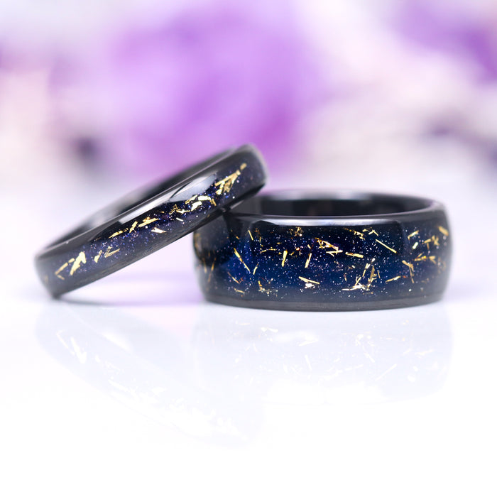 Stardust Couples Ring Set by Aquamarise featuring matching black finish bands with deep blue inlay and delicate gold flecks, inspired by celestial night skies, part of Matching Couples' Rings and Best Selling Jewelry collections.