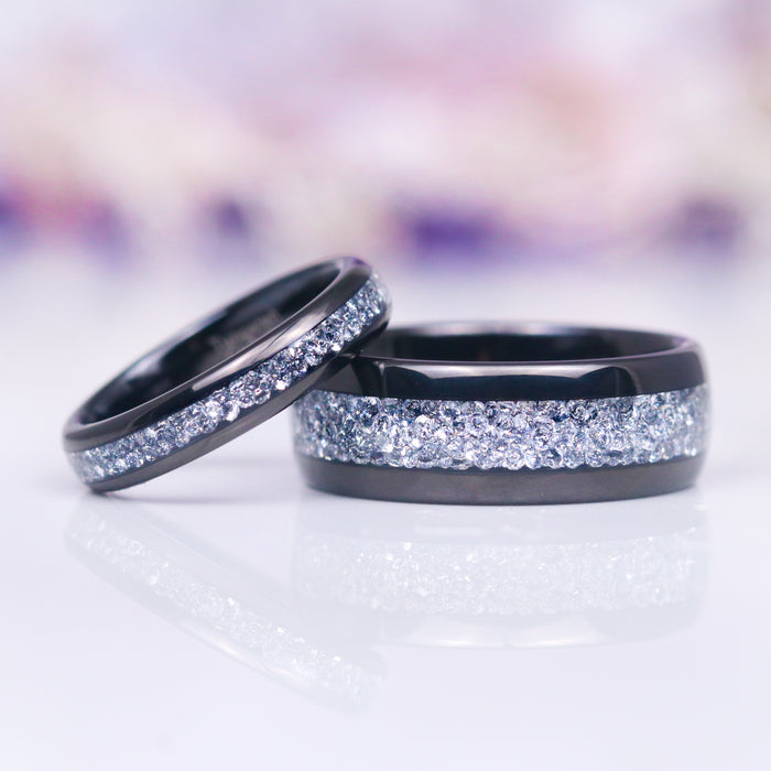 Starlux Simulated Crushed Diamond Couples Ring Set by Aquamarise featuring polished black tungsten carbide bands with a dazzling inlay of crushed silver stones, perfect for Matching Couples' Rings and April Birthstone Jewelry collections.