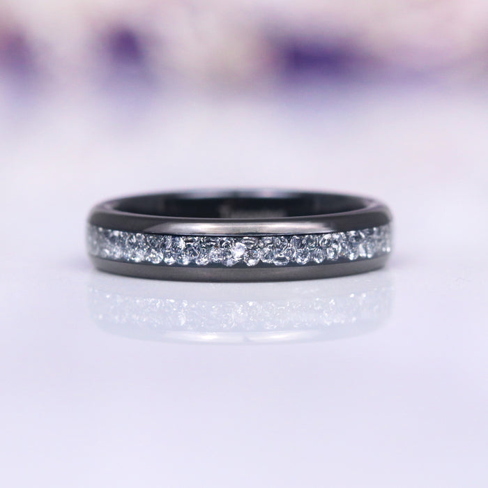 Starlux Simulated Crushed Diamond Couples Ring Set featuring a sleek black tungsten carbide band with a shimmering row of crushed silver stones, crafted by Aquamarise for Matching Couples' Rings and April Birthstone Jewelry collections.