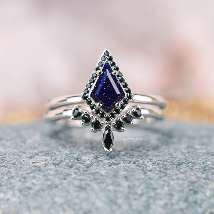Starry Night Couples Ring Set featuring a dark blue sandstone center with black gemstone accents on a polished silver band by Aquamarise, inspired by celestial elegance for matching couples rings.