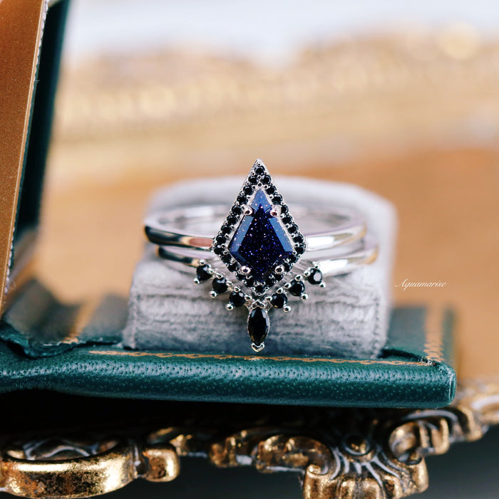 Starry Night Couples Ring Set by Aquamarise featuring a kite-shaped blue sandstone centerpiece framed by black gemstones on a polished silver band in an elegant vintage-style setting.