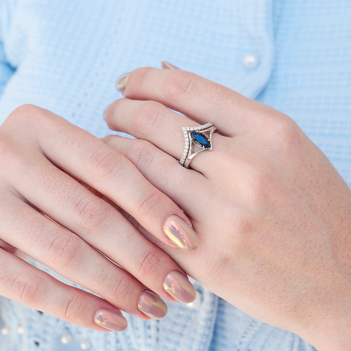Starry Night Chevron Engagement Ring Set- 14K White Gold by Aquamarise Gold, featuring a marquise deep blue gemstone and a chevron-shaped band accented with small shimmering stones, inspired by celestial themes.