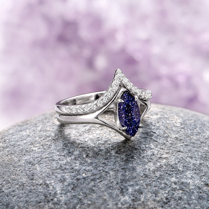 Starry Night Chevron Engagement Ring Set- 14K White Gold by Aquamarise Gold, showcasing a marquise-cut deep blue sparkling gemstone nestled in a chevron-shaped band adorned with small shimmering diamonds, inspired by celestial and fantasy themes.