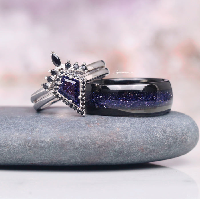 Starry Night Wedding Band- 8MM Black Tungsten by Aquamarise with a sparkling crushed galaxy inlay beside an ornate ring featuring a kite-shaped blue stone and black accent gems.