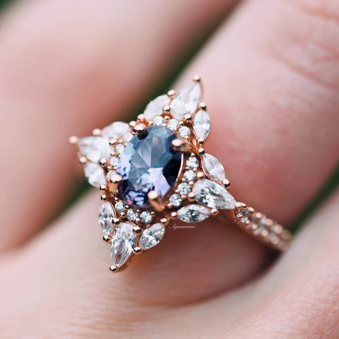Stella Alexandrite Ring- 14K Rose Gold Vermeil by Aquamarise, showcasing an oval color-shifting alexandrite surrounded by marquise and pear-shaped stones on a delicate rose gold band.