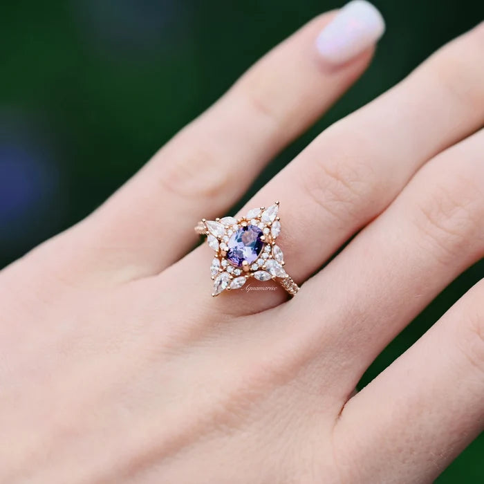 Stella Alexandrite Ring- 14K Rose Gold Vermeil by Aquamarise, featuring an oval color-changing alexandrite surrounded by a vintage-inspired floral halo on a delicate rose gold band.