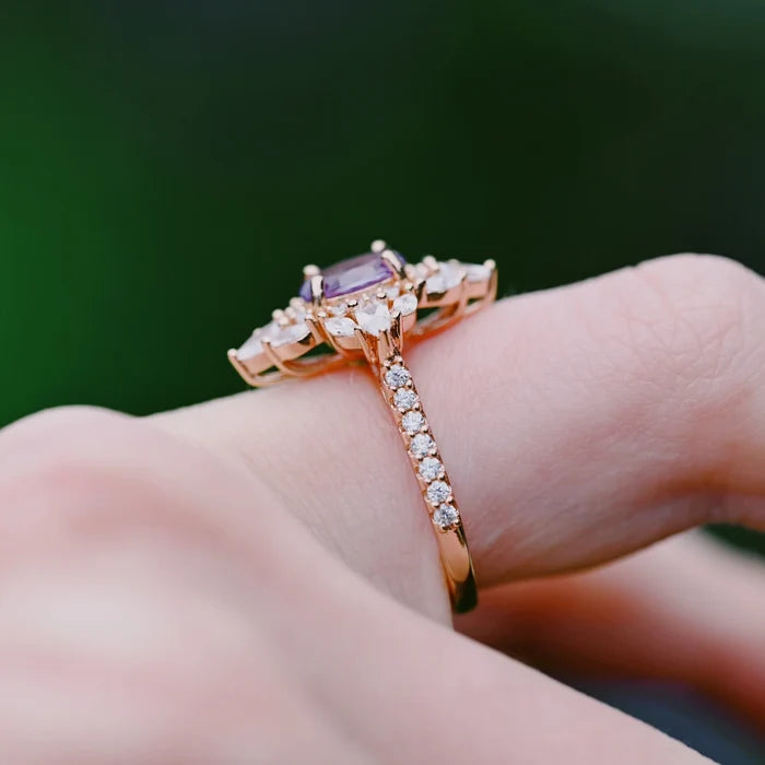 Stella Alexandrite Ring- 14K Rose Gold Vermeil by Aquamarise, featuring an oval alexandrite center with diamond accents along the band on a hand, showcasing vintage-inspired elegance.
