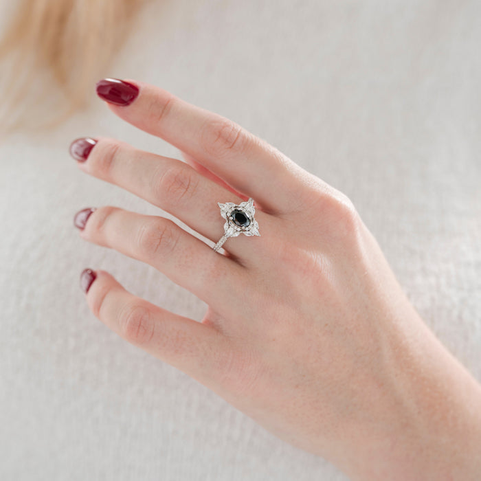 Stella Black Moissanite Engagement Ring in 14K White Gold by Aquamarise Gold featuring an oval black moissanite center with vintage-inspired white gold band and delicate accent stones.
