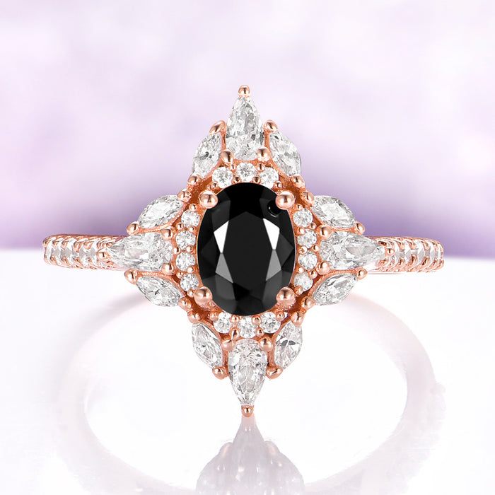 Stella Black Onyx Ring in 14K Rose Gold Vermeil by Aquamarise, featuring an oval black onyx centered in a north-star halo of marquise and round accents.