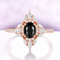 Stella Black Onyx Ring in 14K Rose Gold Vermeil by Aquamarise, featuring an oval black onyx centered in a north-star halo of marquise and round accents.