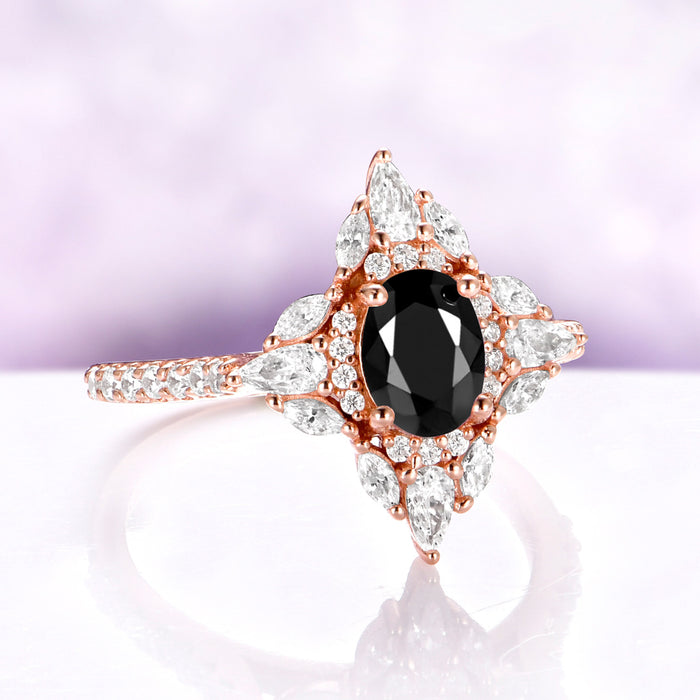 Stella Black Onyx Ring in 14K Rose Gold Vermeil by Aquamarise, angled view showing the oval black onyx and its star-shaped halo.