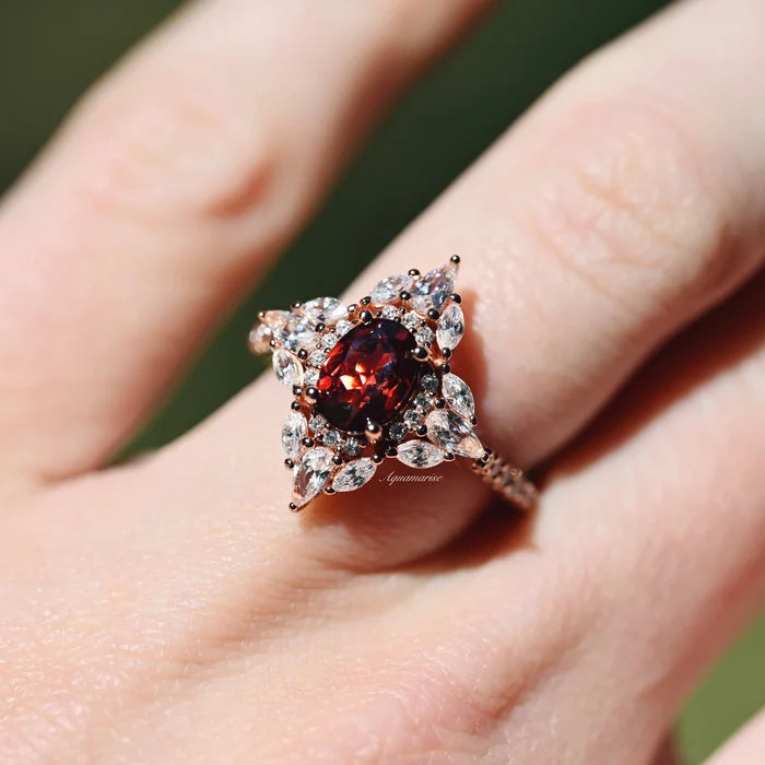 Stella Natural Red Garnet Ring- 14K Rose Gold Vermeil by Aquamarise featuring a vintage-inspired garnet center with sparkling marquise white stones on a rose gold vermeil band.