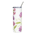 Tumbler with floral design and metal straw on a white background