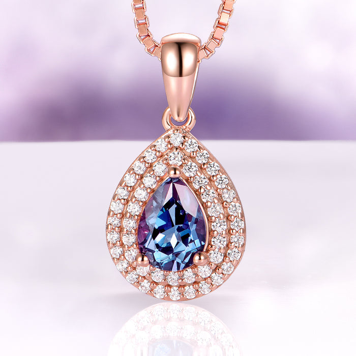 Teardrop Alexandrite Necklace in 14K Rose Gold Vermeil by Aquamarise featuring a lab-grown color-changing alexandrite surrounded by a double halo of sparkling stones.