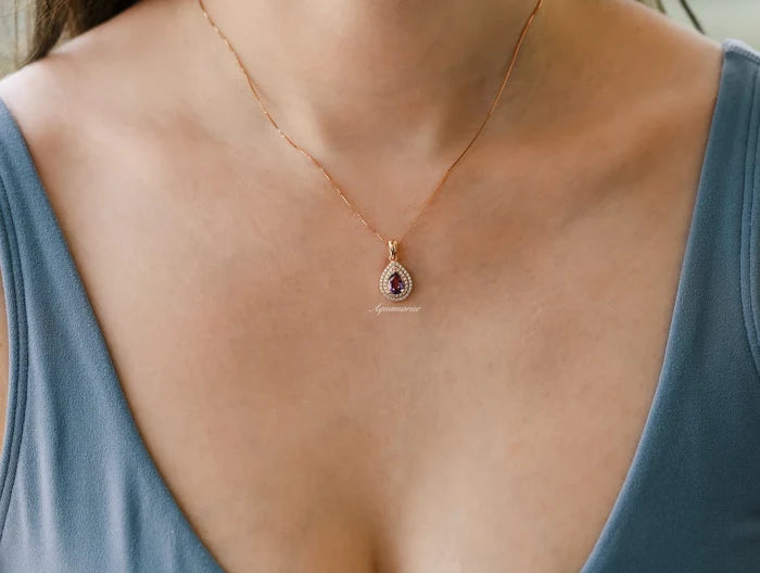 Teardrop Alexandrite Necklace in 14K Rose Gold Vermeil by Aquamarise featuring a lab-grown color-changing alexandrite surrounded by a double halo on a delicate rose gold chain.
