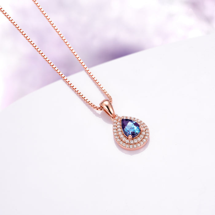 Teardrop Alexandrite Necklace in 14K Rose Gold Vermeil by Aquamarise, featuring a lab-grown color-changing alexandrite with a double halo of sparkling stones, perfect for meaningful gifts.