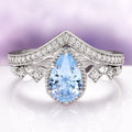 Teardrop Aquamarine Engagement Ring Set in 14K White Gold featuring a pear-shaped aquamarine center stone with sparkling diamond accents on a white gold band, part of Aquamarise Gold’s March Birthstone Jewelry and Solid Gold Engagement Rings collections.