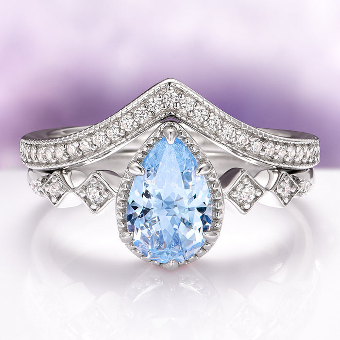 Teardrop Aquamarine Engagement Ring Set in 14K White Gold featuring a pear-shaped aquamarine center stone with sparkling diamond accents on a white gold band, part of Aquamarise Gold’s March Birthstone Jewelry and Solid Gold Engagement Rings collections.