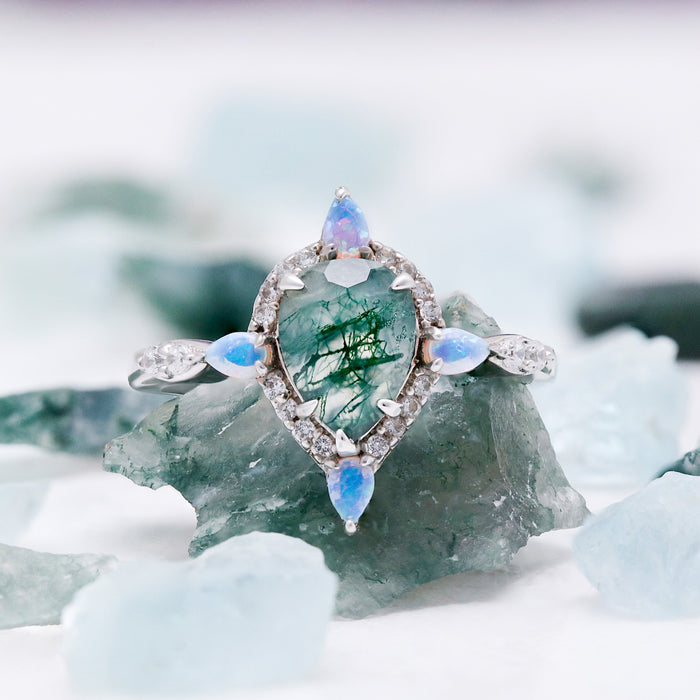 Teardrop Green Moss Agate & Fire Opal Engagement Ring in Sterling Silver by Aquamarise, a pear-cut moss agate with marquise opal accents on aquamarine stones.
